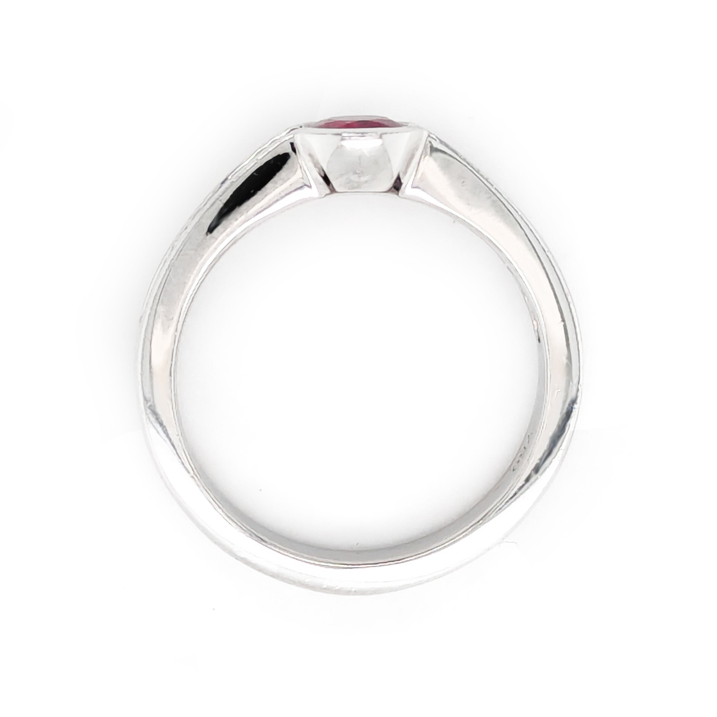 Bezel set Ruby and Baguette Diamond ring in 18kt white gold