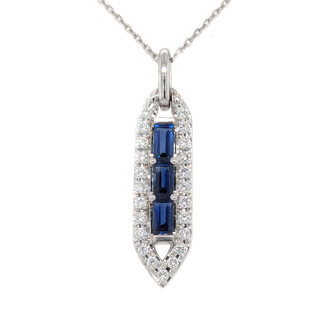 Diamond and blue sapphire white gold pendant on a white background
