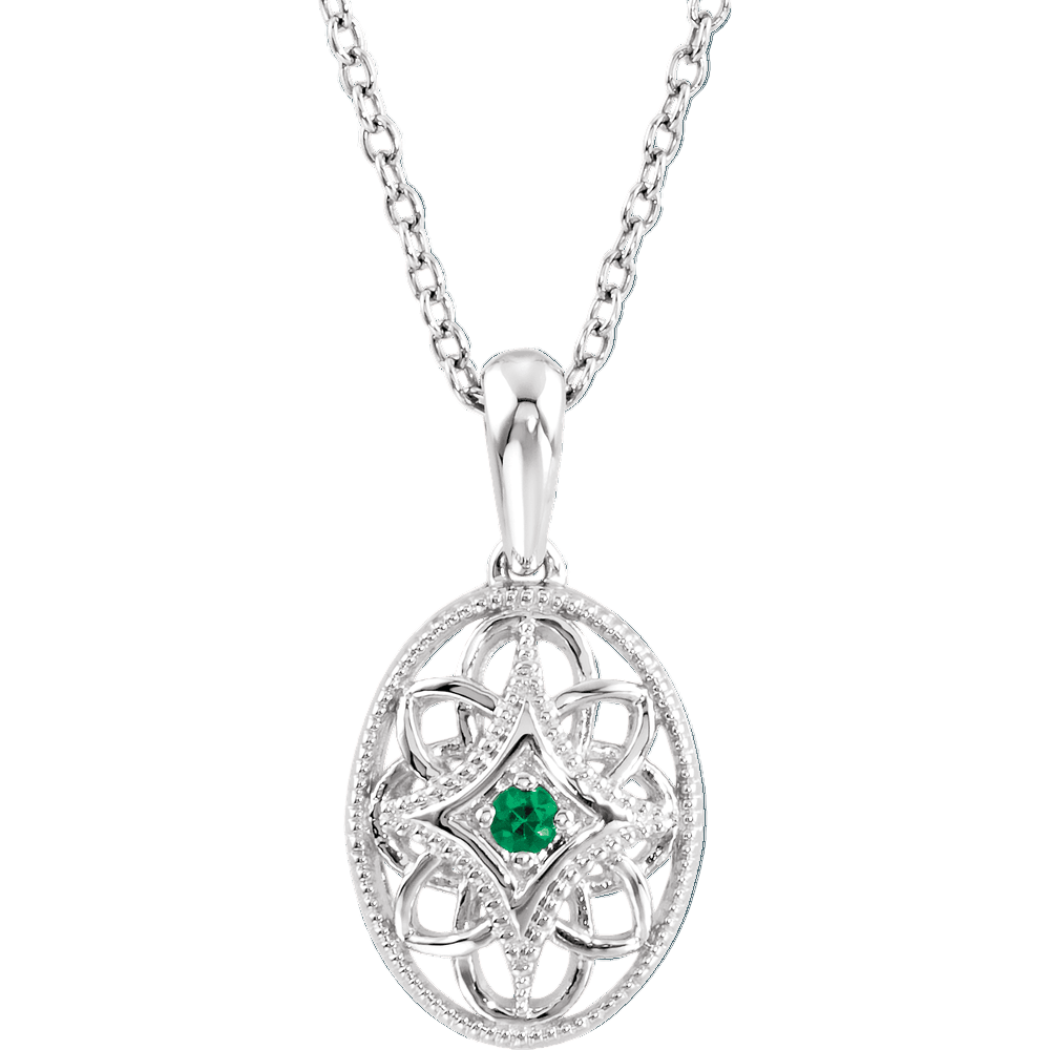 Silver pendant with green gemstone on a white background